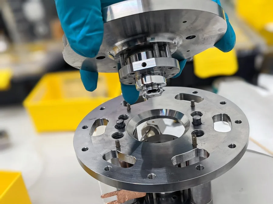 close up of a high-density fusion cell bein -assembled in a portable clean room